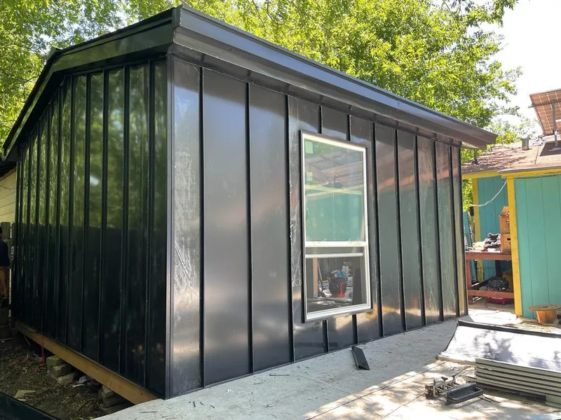 Black standing seam metal wall panels for Roof Inspection in St. Johnsbury