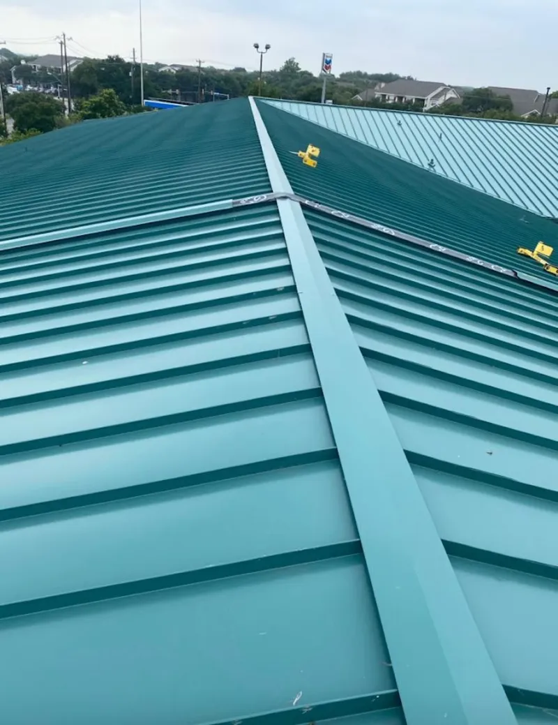 Green commercial metal roof ridge and valley for Metal Roof Repair in St. Johnsbury